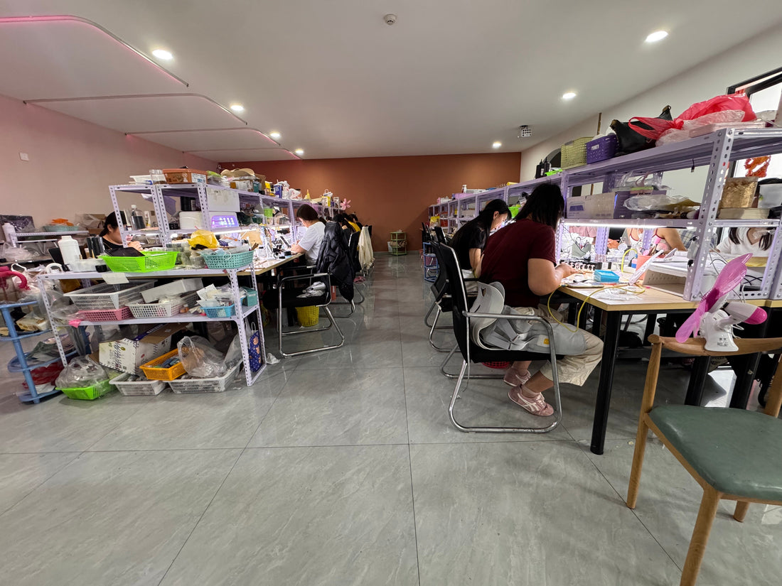 Velnora press-on nail production workshop with artisans working at nail stations