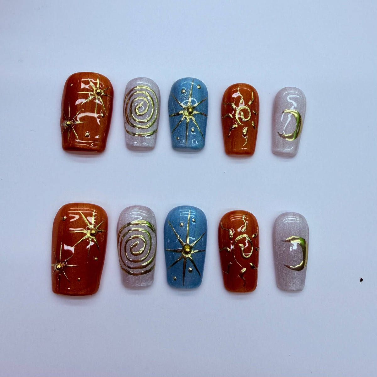 VNL-SH-001 rust blue gold celestial custom short press-on nails by Velnora